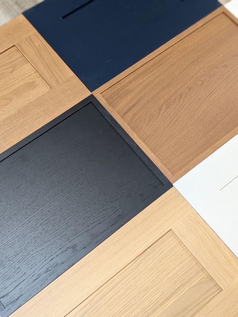 Mullen Factory Direct kitchen cabinet door samples in blue, white, black and wood colors