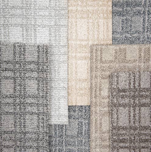Multiple staggered plaid geometric carpet samples in grays and tans
