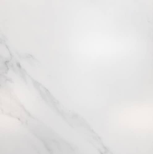 Sample of Cararra Bianco, a white marble stone look vinyl tile with light gray veining throughout