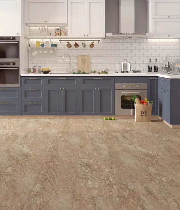 Blue and white kitchen with bag of groceries on beige, gray, and cream speckled stone luxury vinyl tile