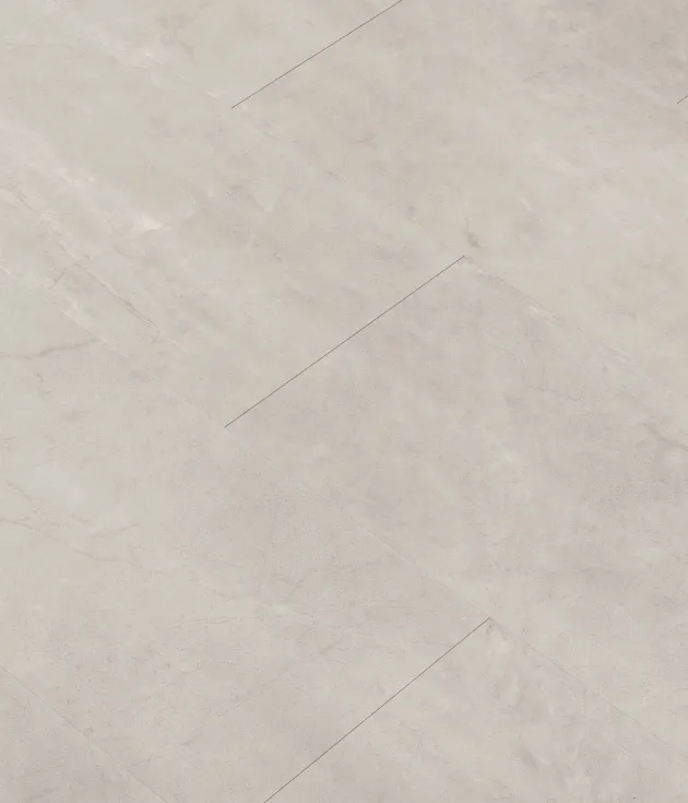 Rejuvenation 567 sample, a light/medium gray rectangular luxury vinyl tile with slight veining