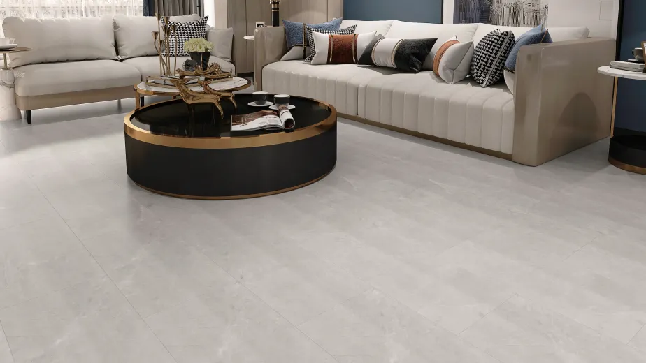 Luxe high-end living room with two sofas, black and gold coffee table, and two white and black side tables over light gray LVT floor