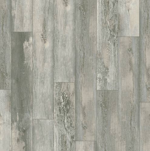 Sample of Rockwood Bluestone luxury vinyl plank, a lightly weathered and distressed light blue-gray plank with woodgrain detailing