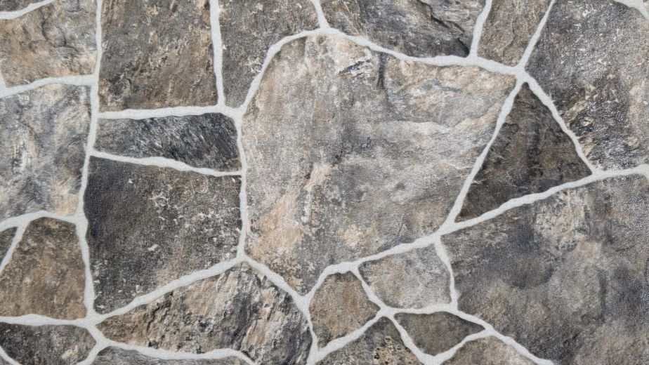 Earthbound Fossil sheet vinyl sample, showing rustic gray and brown stones with white grout between