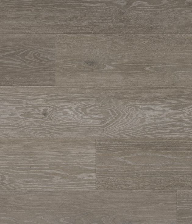 Sample of Grey Artisan Oak luxury vinyl plank, showing medium gray wood plank with blue-gray undertones, knots, and grain detail