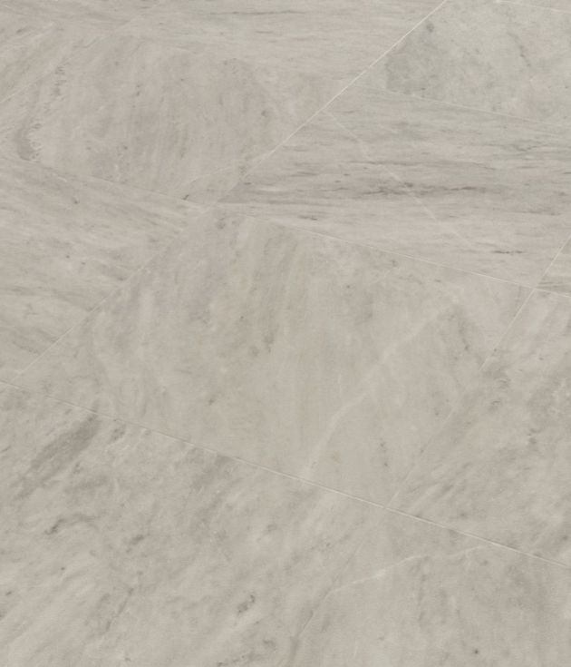 Sample of Ionic Marble LVT, a gray luxury vinyl tile with white and medium gray veining for a clean, neutral design