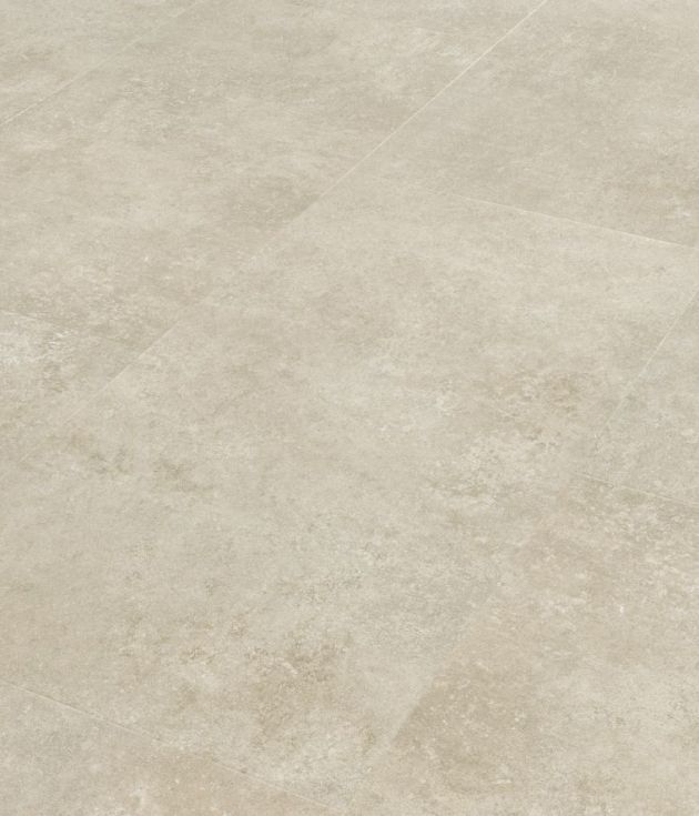 Sample of Pavimento Crema, a rectangular cream concrete-look tile with touches of beige