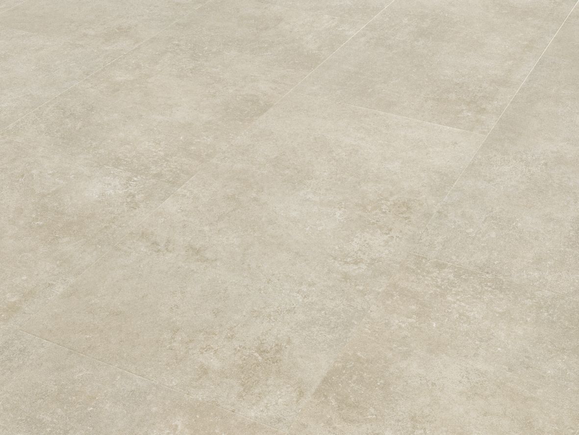 Sample of Pavimento Crema, a rectangular cream concrete-look tile with touches of beige
